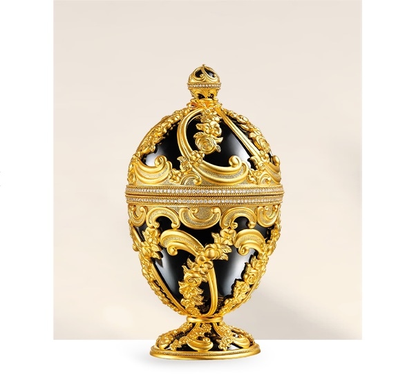 V&A Birth: a gold egg-shaped treasure box with black enamel and engraved floral motifs